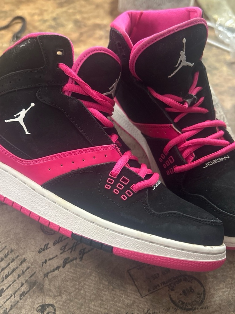 Jordan Women’s High-Top Sneakers in Black & Pink
